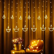 Deals and Offers on - Desidiya Warm White Diya/Diwali Light Curtain, Led String Lights with Pack of 12 Hanging Diyas, 8 Flashing Modes, Decoration, Prong Base Deals, Discounts & Offers on - Desidiya Warm White Diya/Diwali Light Curtain, Led String Lights with Pack of 12 Hanging Diyas, 8 Flashing Modes, Decoration, Prong Base